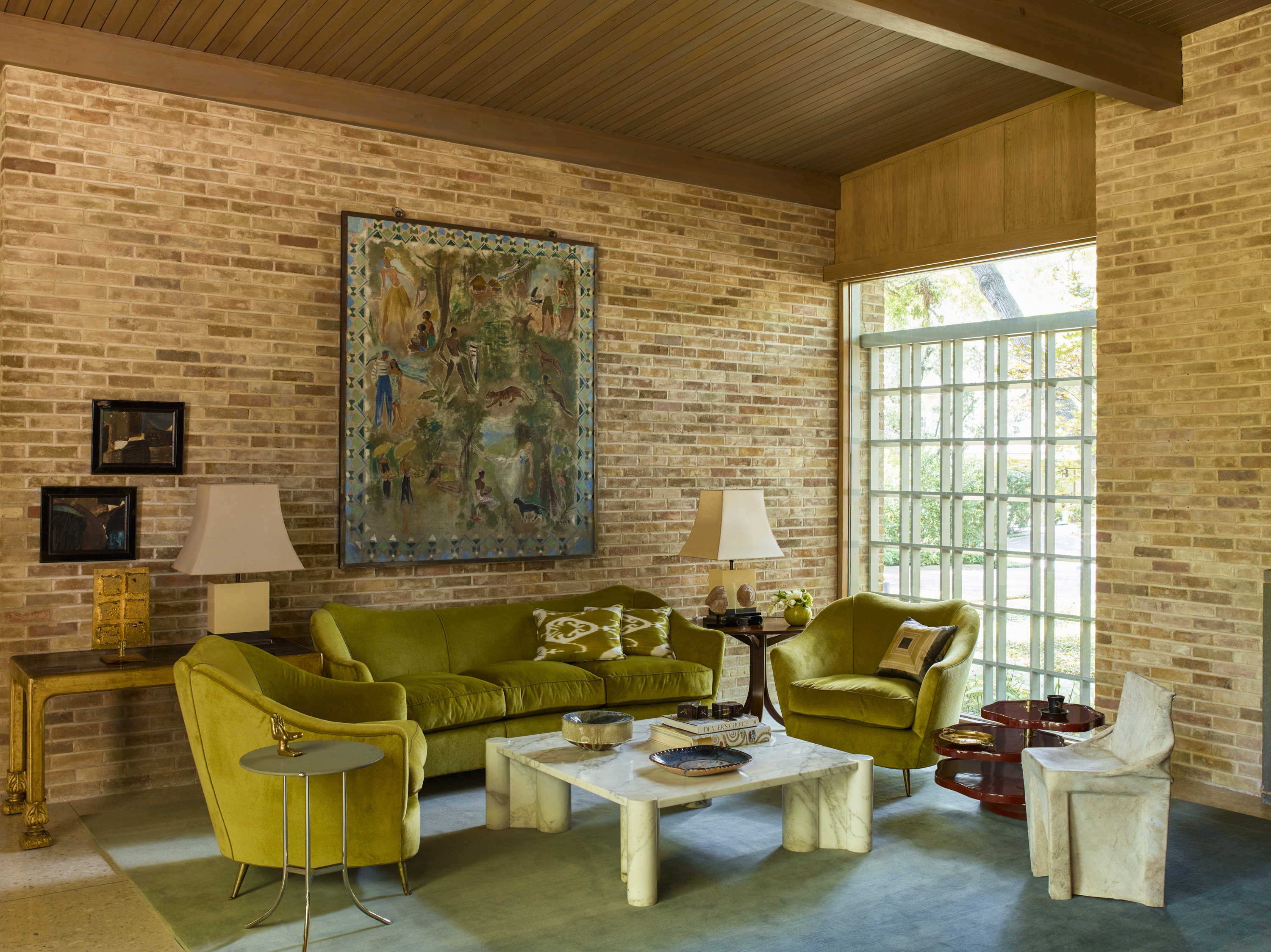 Always a fan of the mix, Summers combines a 1960s Italian sofa and chairs, Gae Aulenti’s marble coffee table, French postwar lacquered lamps, and Niels van Eijk’s 1997 Cow chair. She found the 1940s painting in Paris, and her husband later surprised her with it as a gift. 